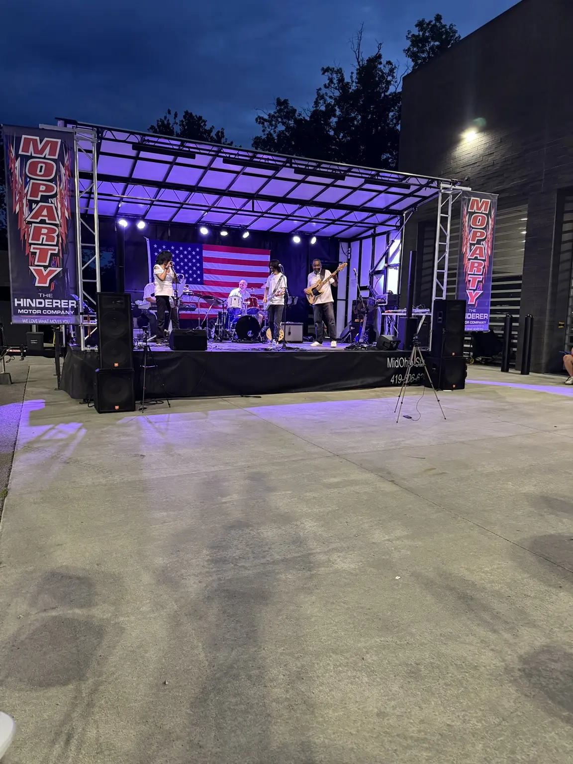 Custom outdoor stage layout for local dealership event and VIP party.