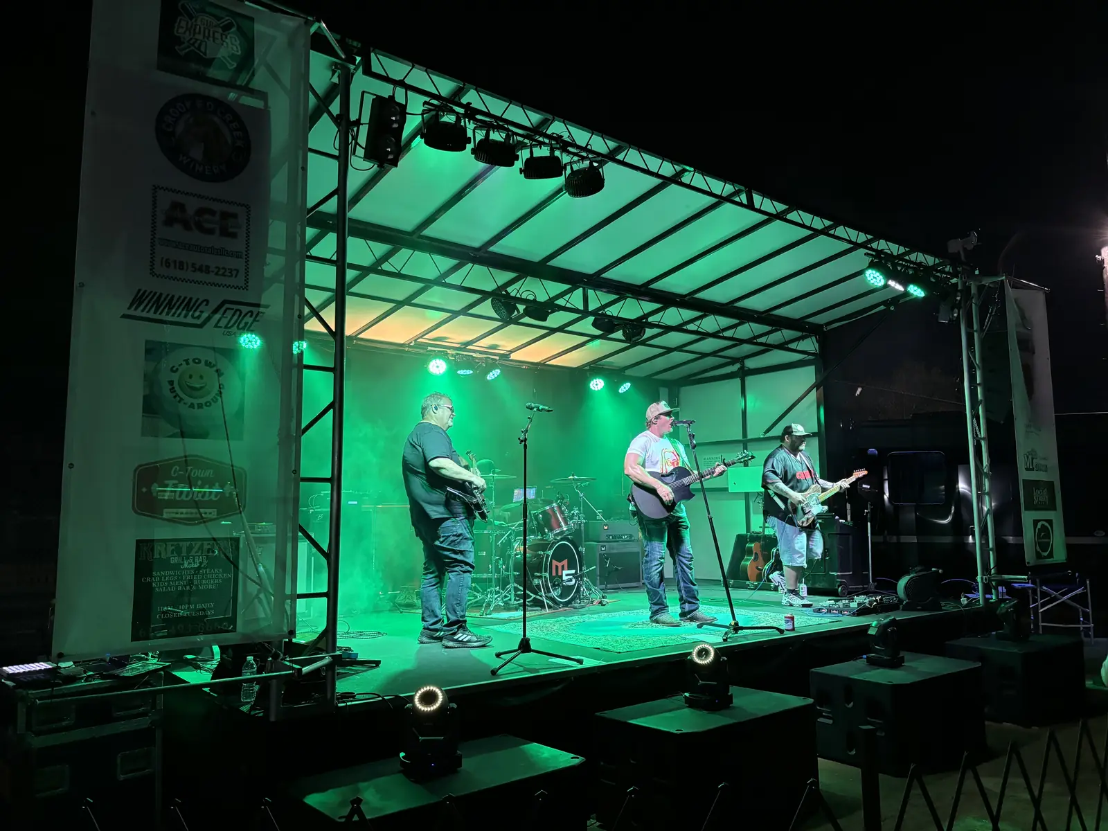 Mobile stage roof truss with lighting at a night concert